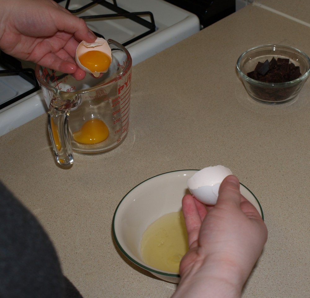 drop the yolk into the other bowl