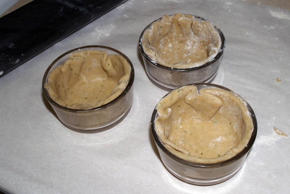 baking dishes lined with pie crust