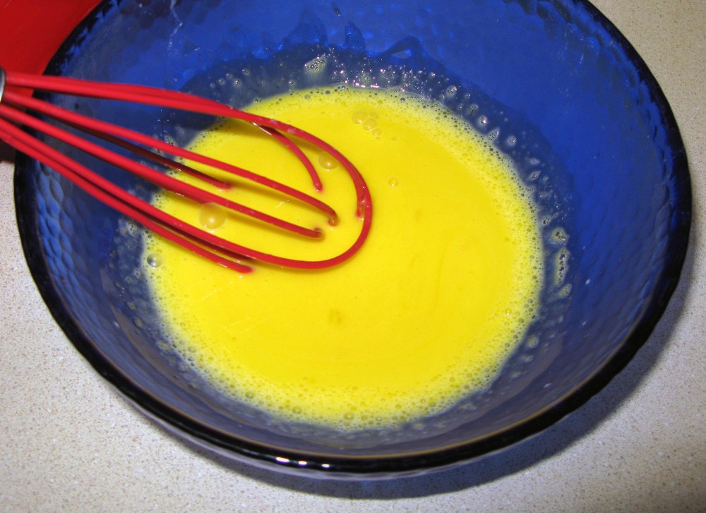 Egg Yolks with First Addition of Hot Cream for Ice Cream